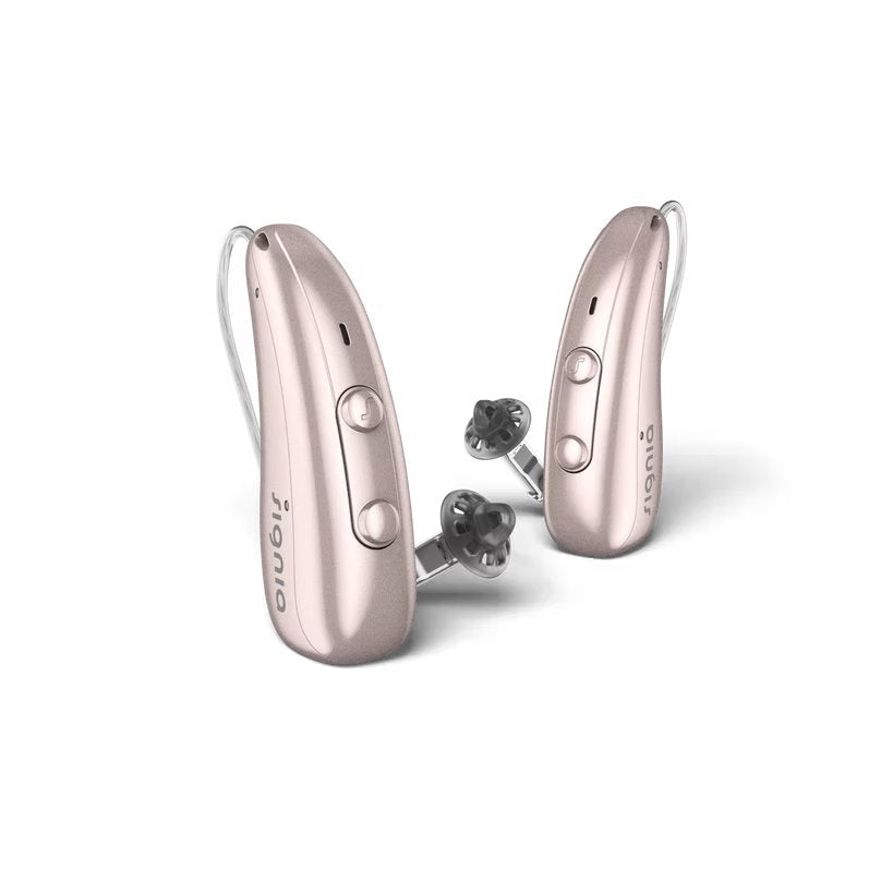Et par Signia Pure høreapparater i rosa